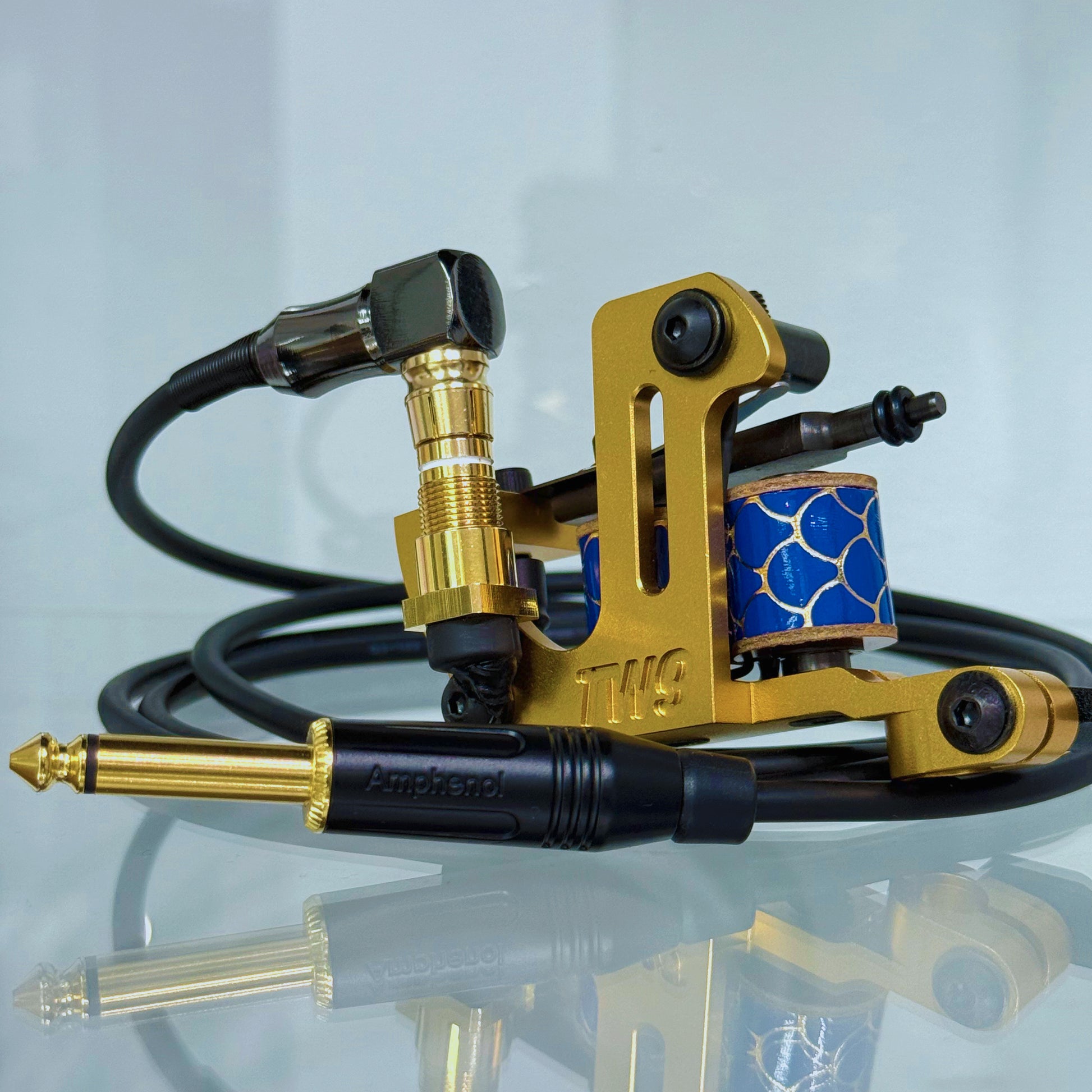 LEBA Fat One gold coil tattoo machine with RCA and clipcord connection, includes 90-degree cable