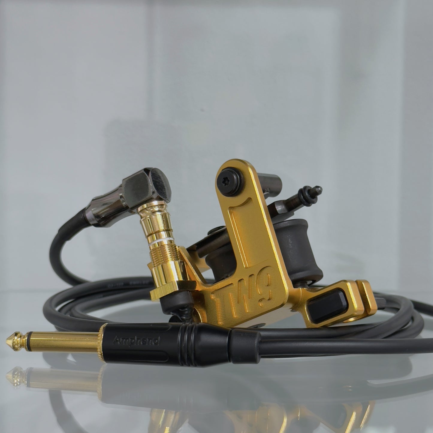 LEBA V2 2.0 gold coil tattoo machine with RCA and clipcord connection, includes 90-degree cable